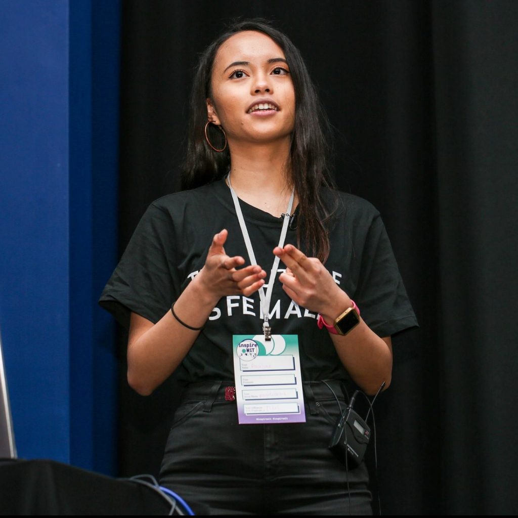 Pauline speaking at a conference